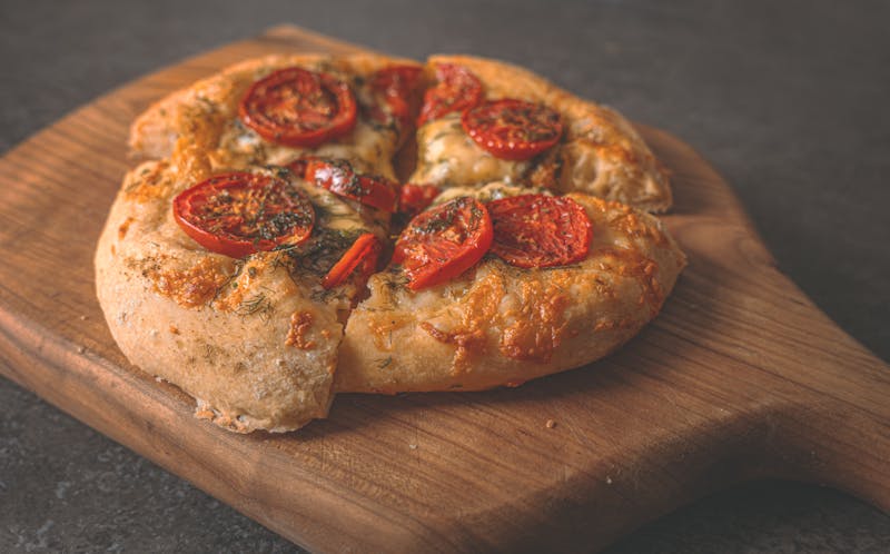 ranch pizza dough being stretched by hand in pizzaranch kitchen